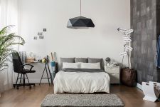 bedroom with white and gray decor and hanging black lamp el paso tx